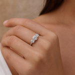 Round Diamond Trilogy Engagement Ring Hand