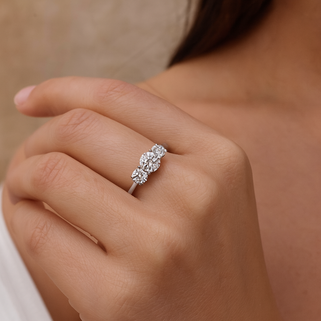 Round Diamond Trilogy Engagement Ring Hand Round Diamond Trilogy Engagement Ring Hand